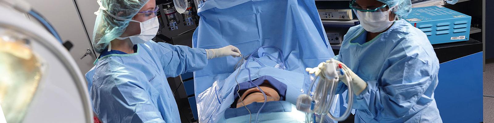 Southeast Tech students in an operating room lab, performing mock surgery.